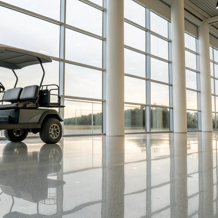 Used custom golf cart for sale in a modern showroom.