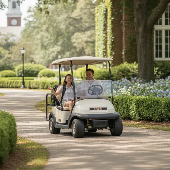 Golf cart on a landscaped college campus path