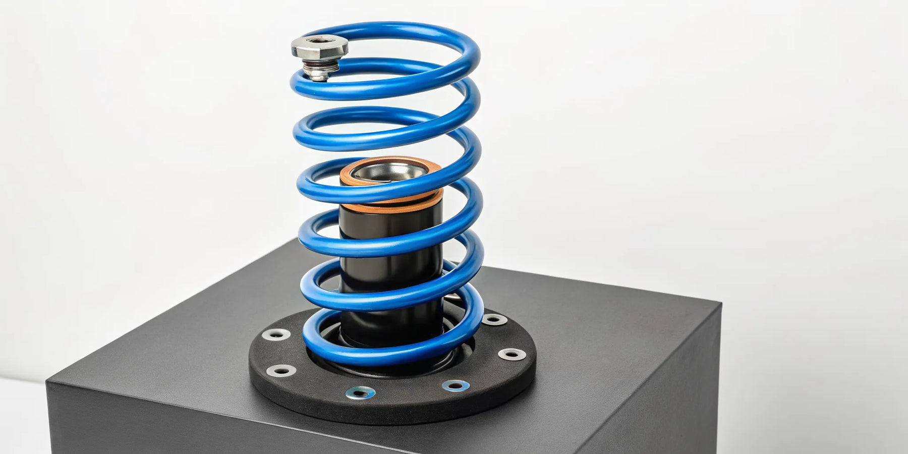 A blue suspension coil spring, a key component that influences the final suspension price.