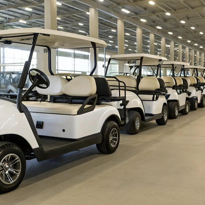 Professionally refurbished golf carts lined up for inspection at a dealership.
