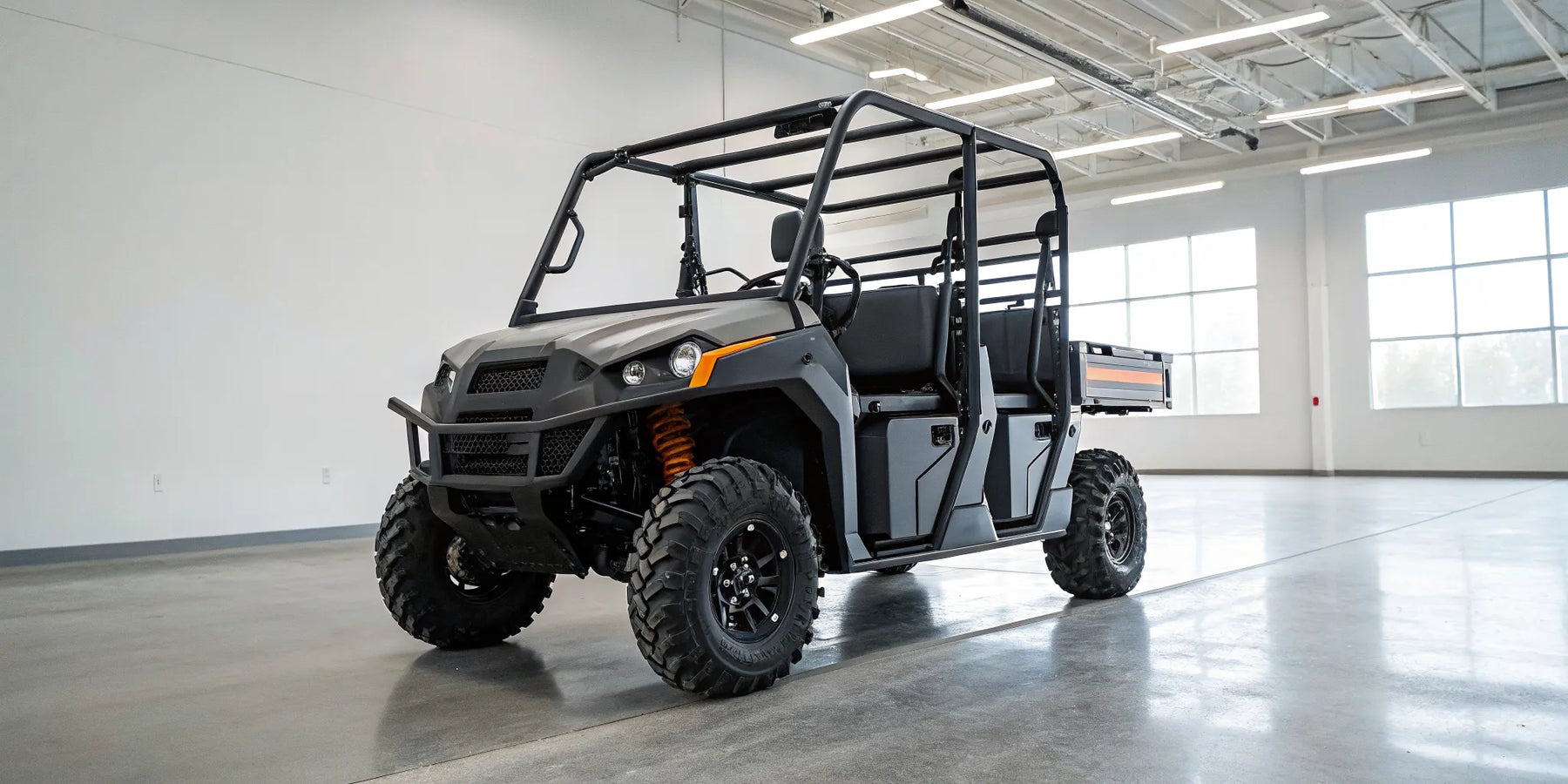Rugged gas powered utility vehicle with a large cargo bed for hauling and towing.