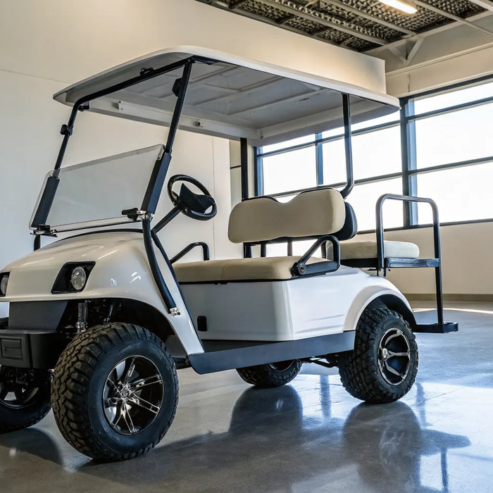 A refurbished electric golf cart with custom seats and wheels on display at a dealership.