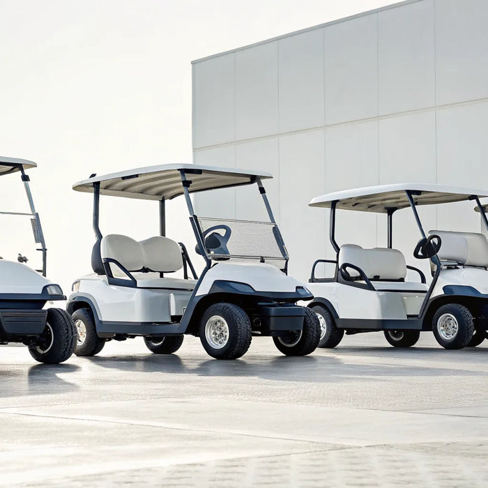 Four different 4-seat forward-facing golf carts parked side-by-side.