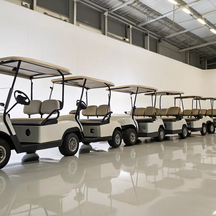 A row of modern 6-seater golf carts with seat belts.
