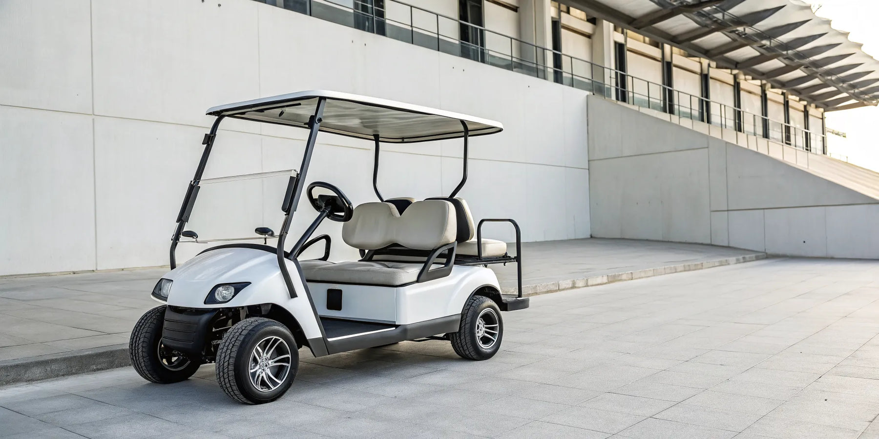 A modern four-seater electric golf cart.